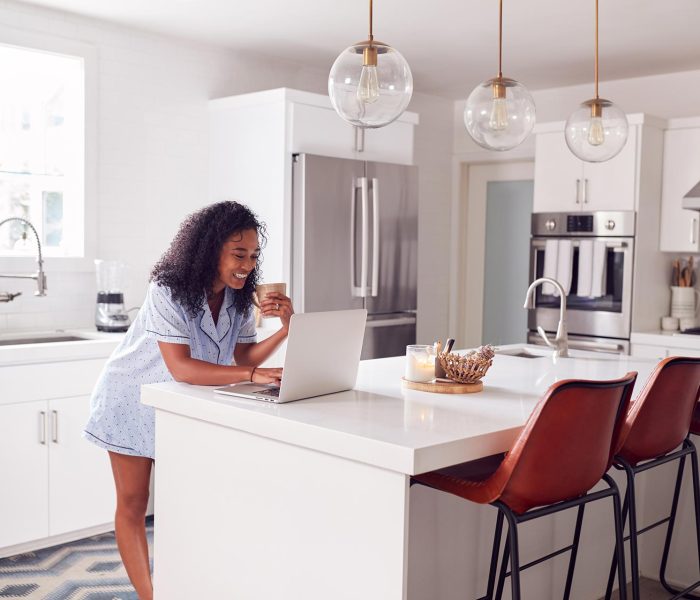 woman-wearing-pyjamas-standing-in-kitchen-working-2022-02-02-03-57-35-utc.jpg